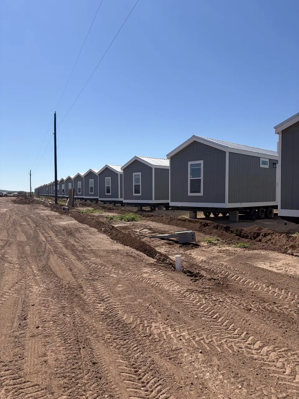 Row of factory-built crew housing units on a Texas job site